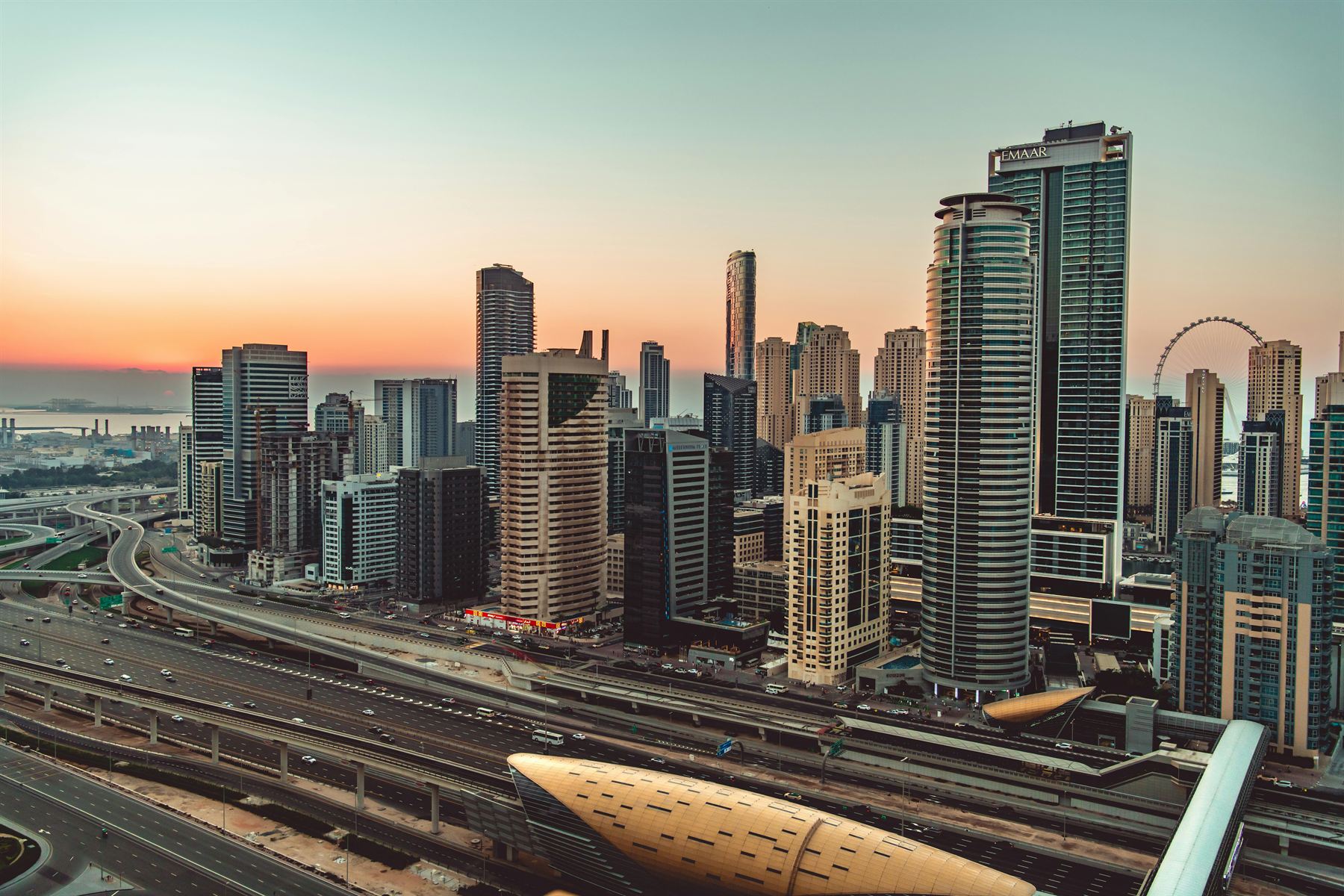 Sheikh Zayed Road and Ain Dubai at sunset