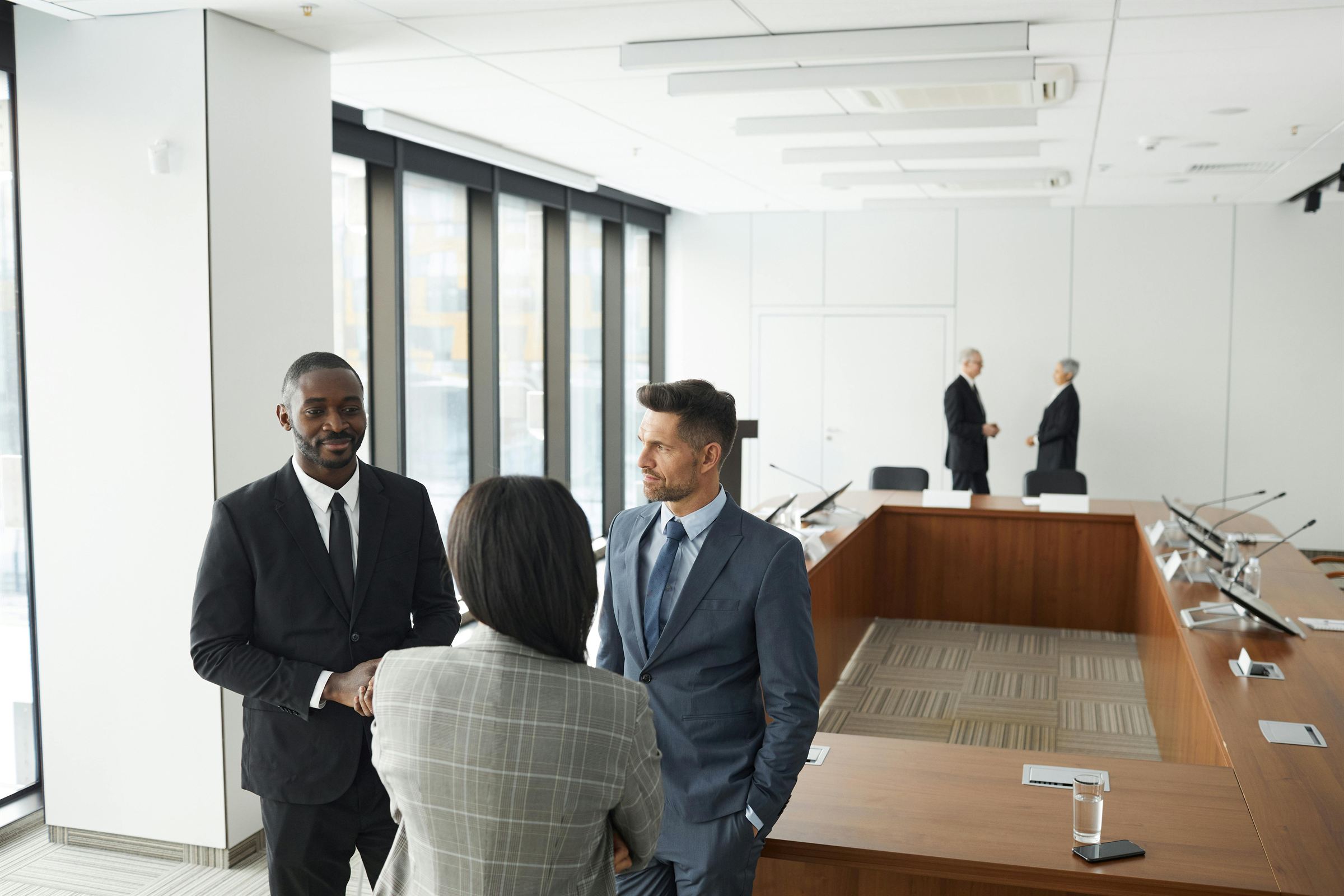 Banker signing documents with a client